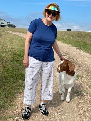 Enjoying a Walk on Lillian Farms Property with their Show Goat that loves to walk alongside you.