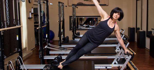 Side plank on Pilates reformer