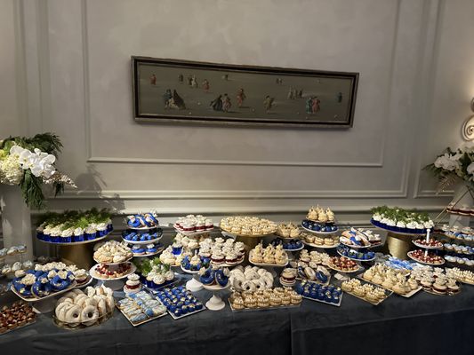 Custom dessert table set up with over 700 pieces of customized pastries