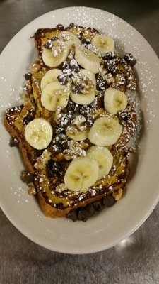 New 12 grain french toast topped with bananas,  walnuts  and chocolate chips!