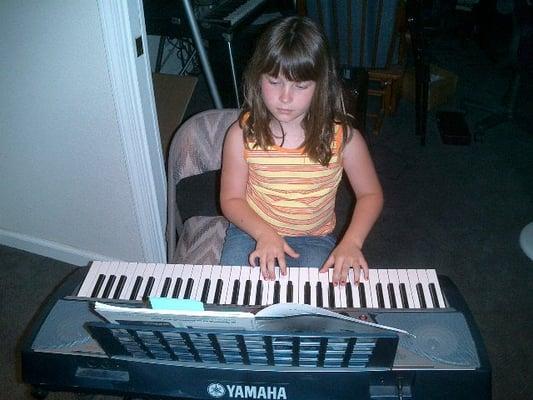 Student practicing piano in Mr Nate's Studio