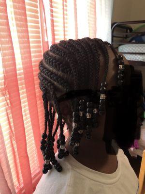 She exactly what she asked for. Wash, blow dry, braids and beads