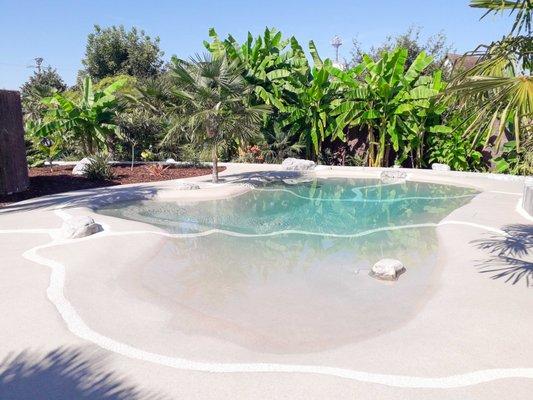 Hand sculpted quartz beach pools create your private beach oasis.