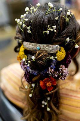 Wedding updo with flowers and silver hair barette with turquoise