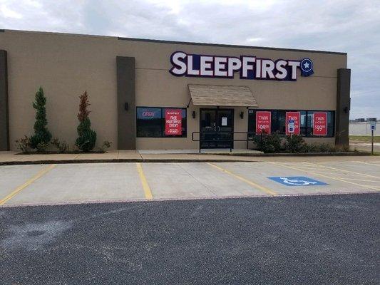 Outside parking at Sleep First mattress store in Longview, Texas