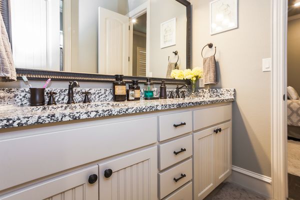 Custom cabinetry in this bathroom with bead board insets