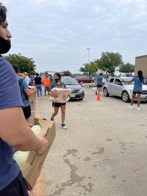 Loading up food in cars.