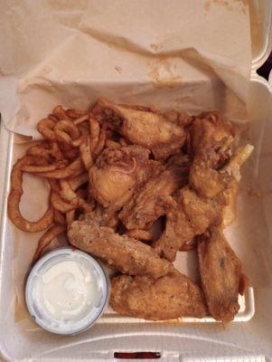 Garlic Parmesan wings with curly fries and ranch dressing