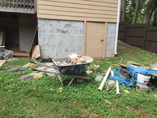 Some of this mess was from a previous contractor, but they were supposed to clean it. Nice unfinished stucco on back wall :(