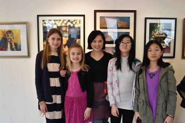 Teacher and students in the Studio Art show opening.