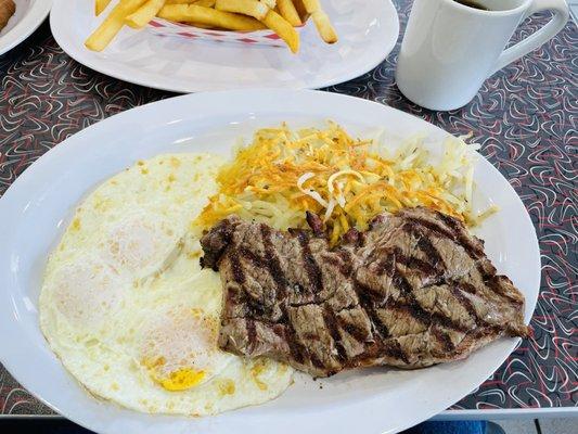 Steak and 3 eggs which comes with hash browns and a side of toast. The steak is a breakfast ribeye which my brother-in-law swears by.