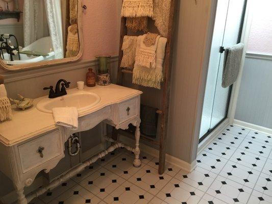 Used an old sewing machine table for a vanity