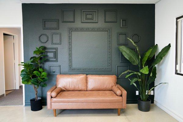 Right side of front room. Green monochromatic wall gives a cool coffee shop aesthetic.