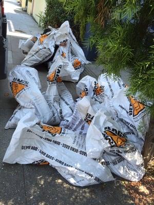 54 bags of dirt hauled from the backyard through the house and down 2 flights of stairs....all done in under an hour