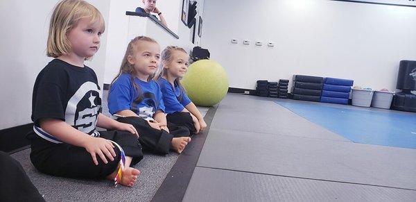 We had new students, Twins! Our veteran ninja is showing them how to sit strong