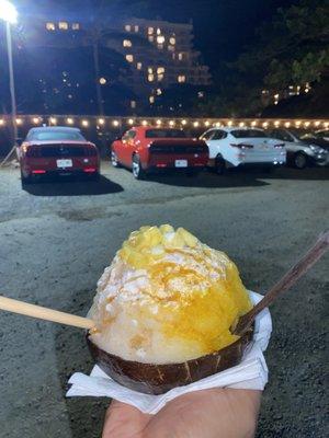 Mango and lychee with vanilla ice cream in a coconut bowl