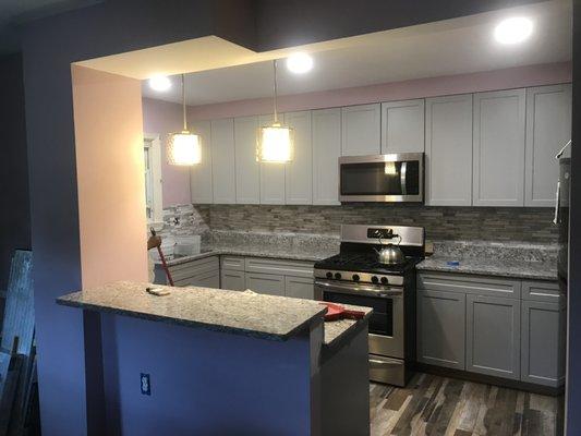 Kitchen remodel. New cabinets, countertops flooring and lights. Also added a bar