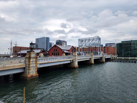 The shop is just behind the Boston tea party ships and museum in this photo in the corner of the Boston children's museum.