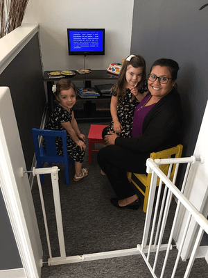 Dr. Patel catching a movie with some of our younger patients in the play area.