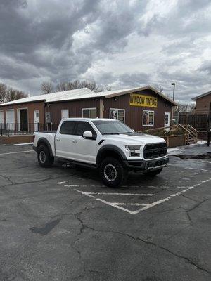 2019 Ford Raptor with 5% in the back, 15% front windows, and a visor.