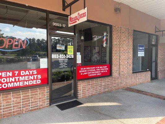 Barbershop entrance not open at time they state and no posted messages saying when they will be in.