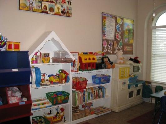 Part of our playroom area with lots of toys and learning activities.