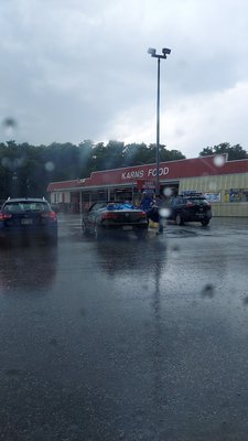 Rain soaking a convertible with a dead battery.