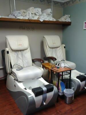 Side by side spa pedicure chairs tucked away in a private room!