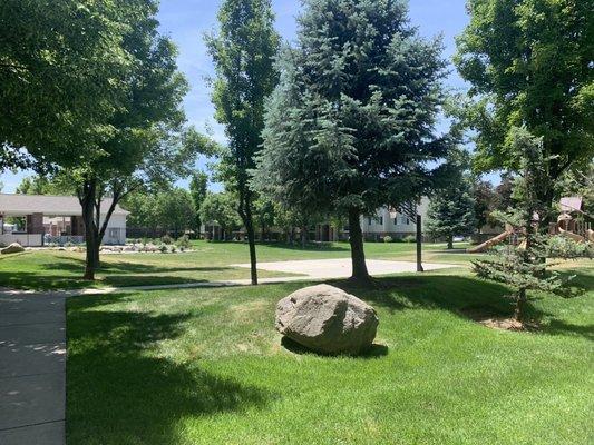 Pool area on the left, half basketball court (there is a full one in another area of the complex) and a playground on the right.