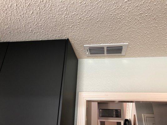 We had to move the vent to extend our new cabinets to the ceiling.