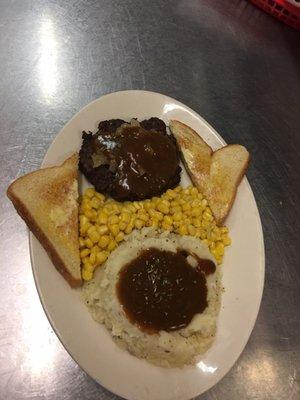 $5.00 lunch special. Hamburger steak with mash potatoes and gravy with mushrooms & onions, served with toast.