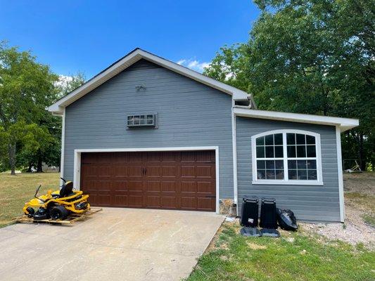 18x7 walnut colored garage door