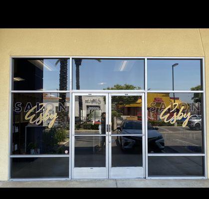 Storefront tint applied with business decals printed and installed