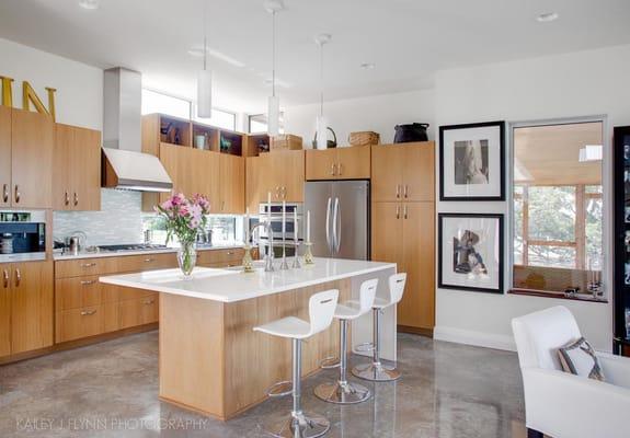 Open plan kitchen with bamboo cabinets.