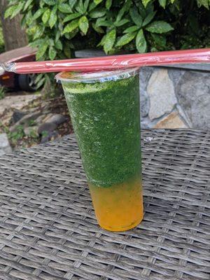 Kale, mint, and mango drink with mango boba