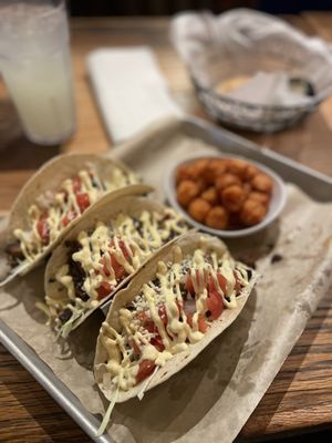 Brisket tacos with sweet potato tots