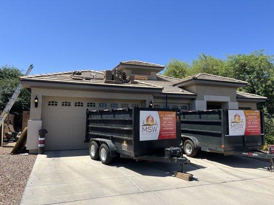 Trailers for the roof debris.