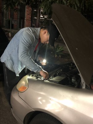 Mr. Li helping change my battery