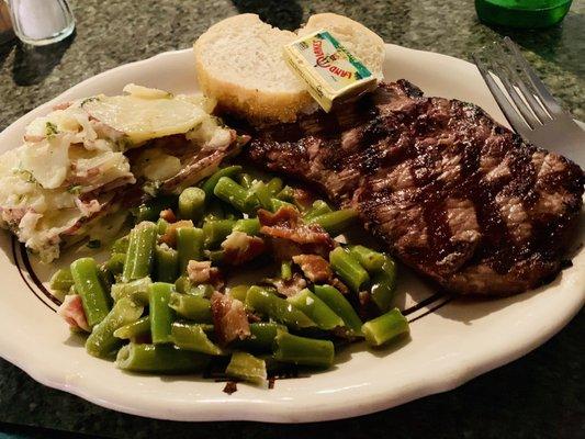 Steak night ribeye with scalloped potatoes and sautéed green beans