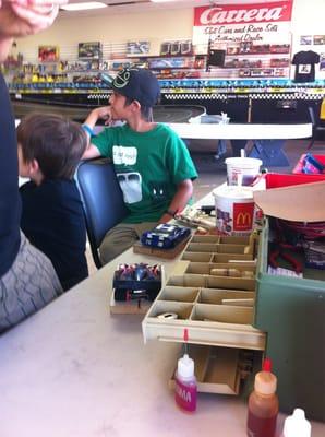 Boys waiting to get their slot car on the track