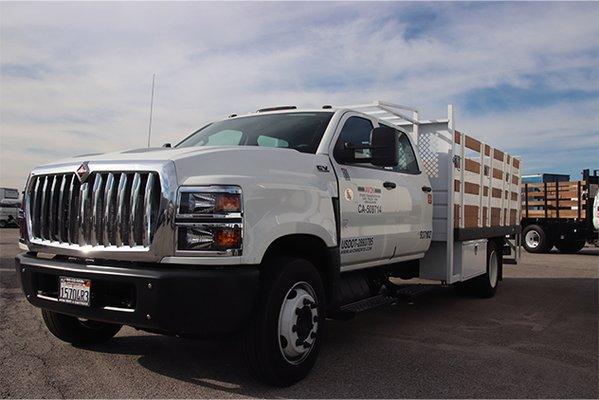 Crew Cab stake bed truck with liftgate.