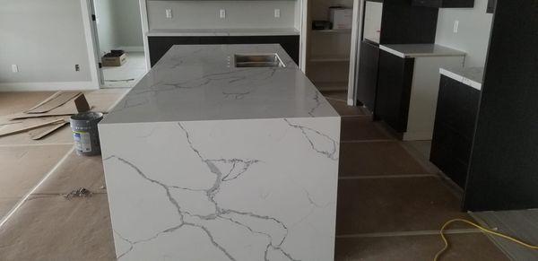 Quartz Countertops project: Calacatta Gold with waterfall island