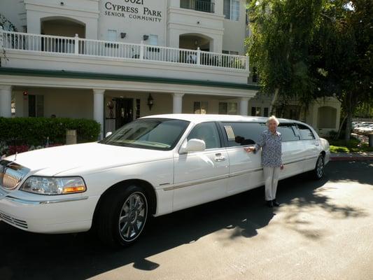 Our 90-yr mom Ermelinda  posing in front of her apt build after a limo ride. The best place to live for Seniors non-assisted Liv