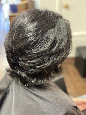 Soft, almost black hair does not have to look harsh. Styled with Olaplex 6 Leave-in de-frizz, Olaplex 7 moisture oil with heat protectant.