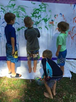 Water gun painting at Summer Art Camp.