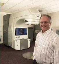 Dr. J. West, Board Certified Radiation Oncologist and Linear Accelerator - machine used to deliver radiation therapy treatments