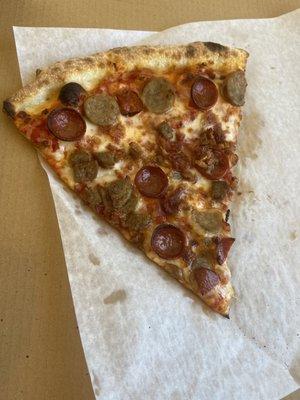 Meat lovers pizza by the slice