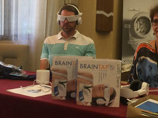 A guest at Perfect Practice event trialing the amazing Brain Tap device. We sell these at Living Well but also help providers sell them.