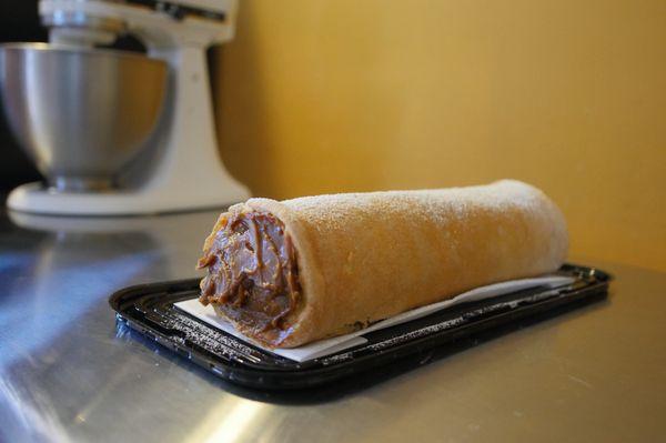 Sweet vanilla cake roll filled with dulce de leche (caramel). (Contains: Milk, Wheat)