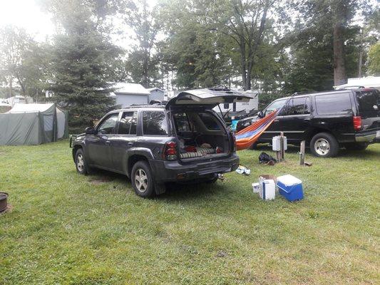 The drunken loud mouths campsite the next morning. Thats a guy sleeping in the SUV, and another in the hammock, and all tgeir garbage.